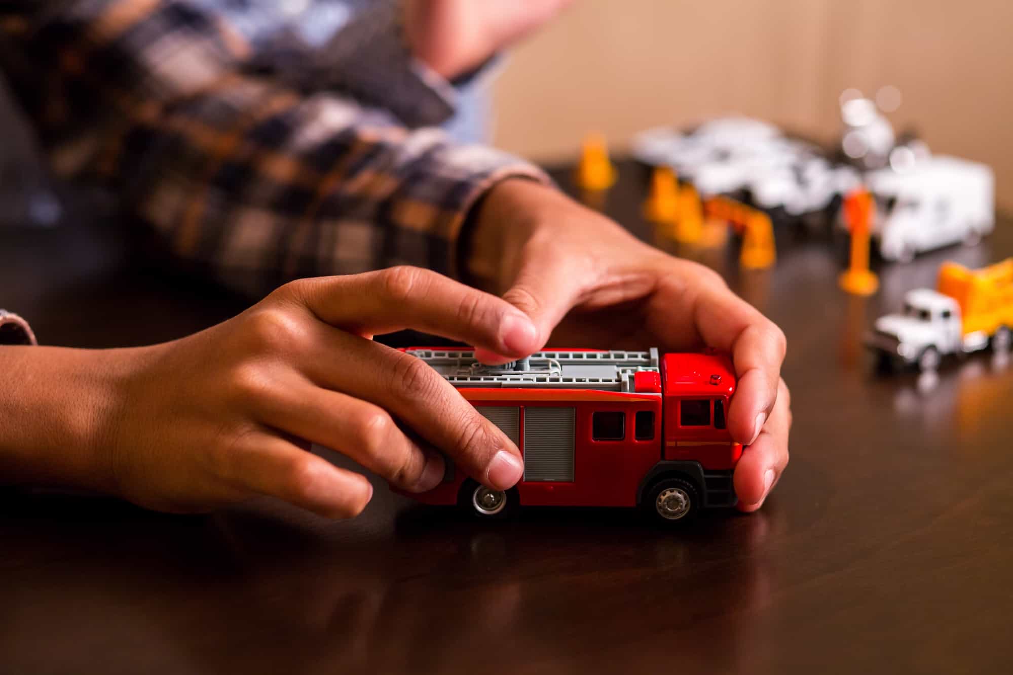 Child playing with firetruck